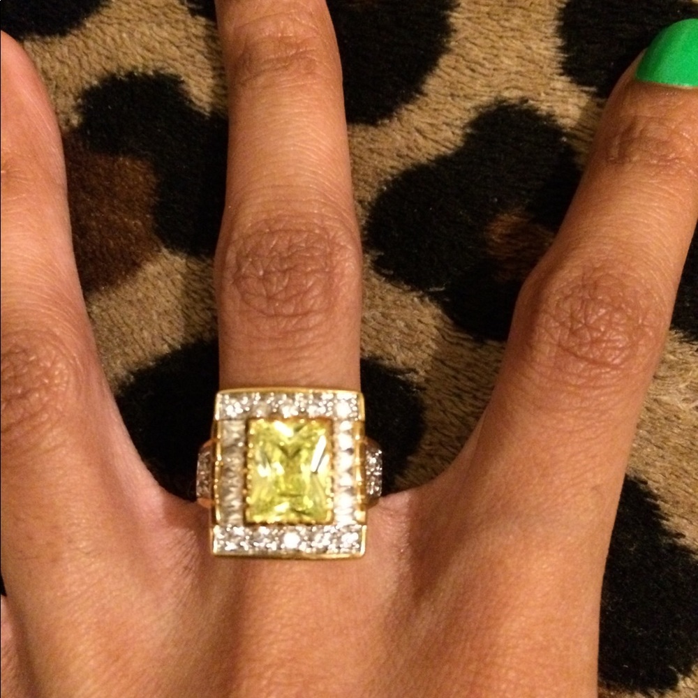 A faux green gemstone ring.